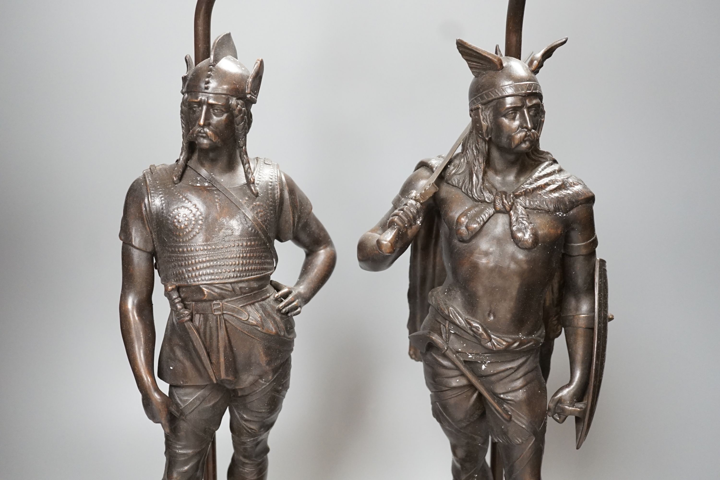 A pair of spelter warrior lamps on marbled plinth base - 62cm high